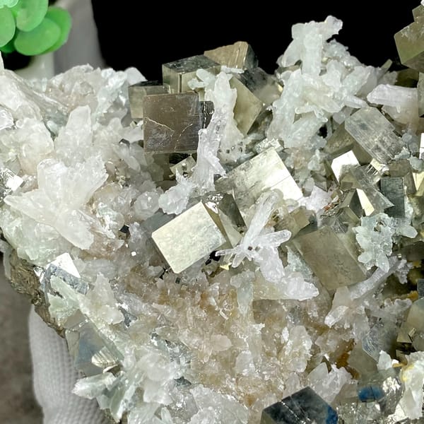 Large cluster of pyrite cubes and white quartz from Hunan, China, close-up of terminations