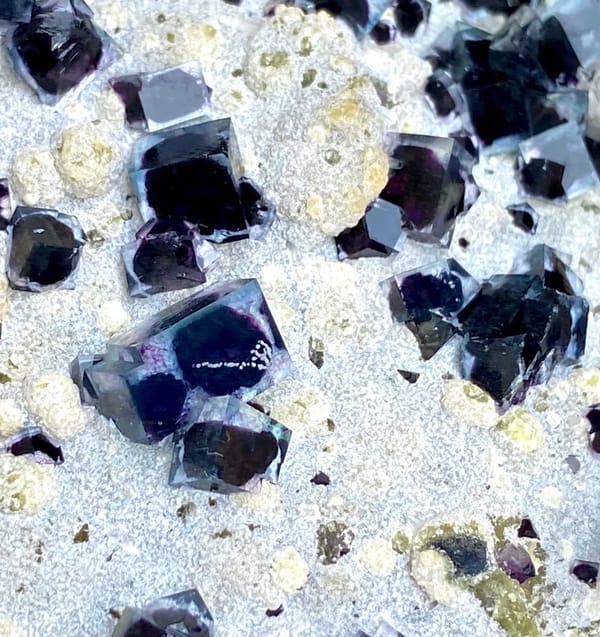 Plate of purple-cored window fluorite on stand from Inner Mongolia, China, top view