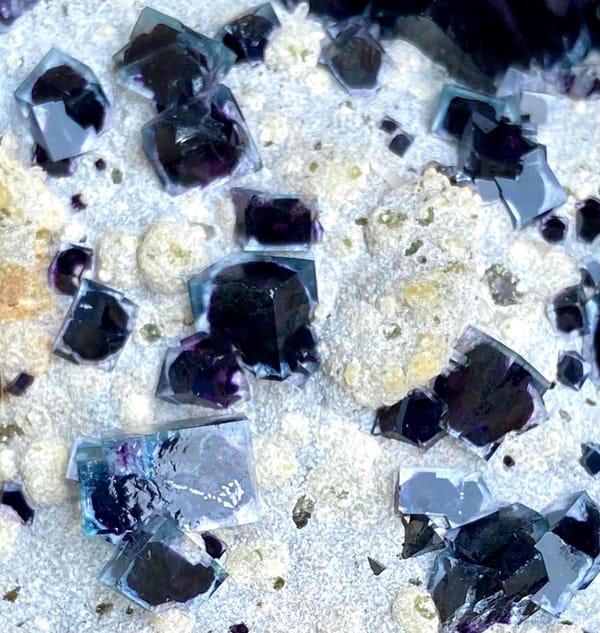 Plate of purple-cored window fluorite on stand from Inner Mongolia, China, overall view