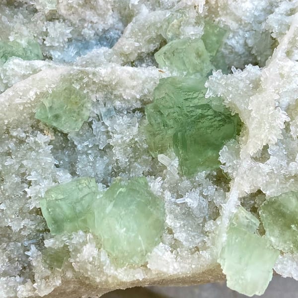 Large plate of pale green stepped fluorite over quartz from Fujian, China, reverse side