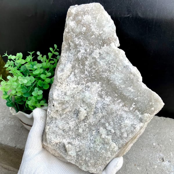 Large plate of pale green stepped fluorite over quartz from Fujian, China, close-up of terminations