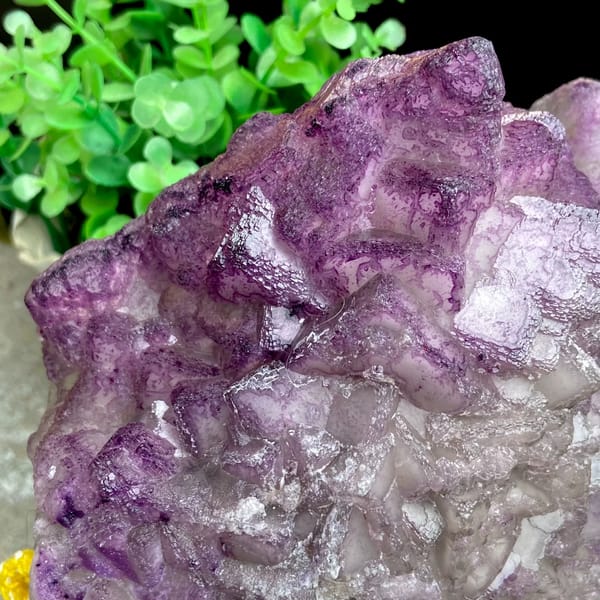 Large purple fluorite boulder with white crystal cap from Guizhou, China, close-up of the crystal faces
