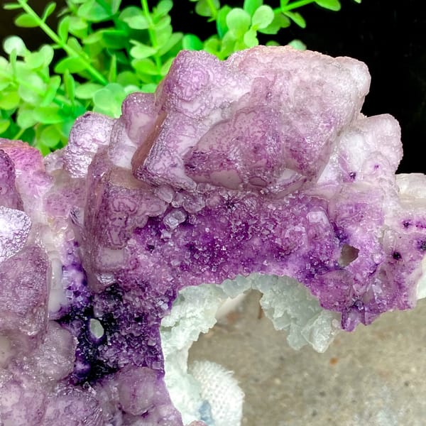 Large purple fluorite boulder with white crystal cap from Guizhou, China, detail of the matrix contact