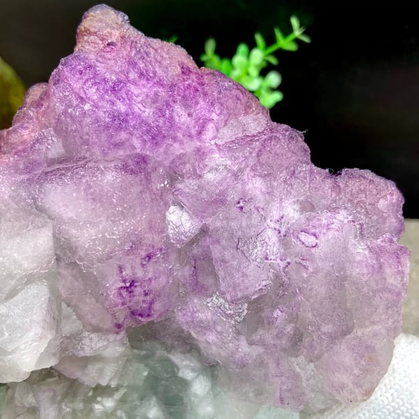 Large purple fluorite boulder with white crystal cap from Guizhou, China, close-up of terminations