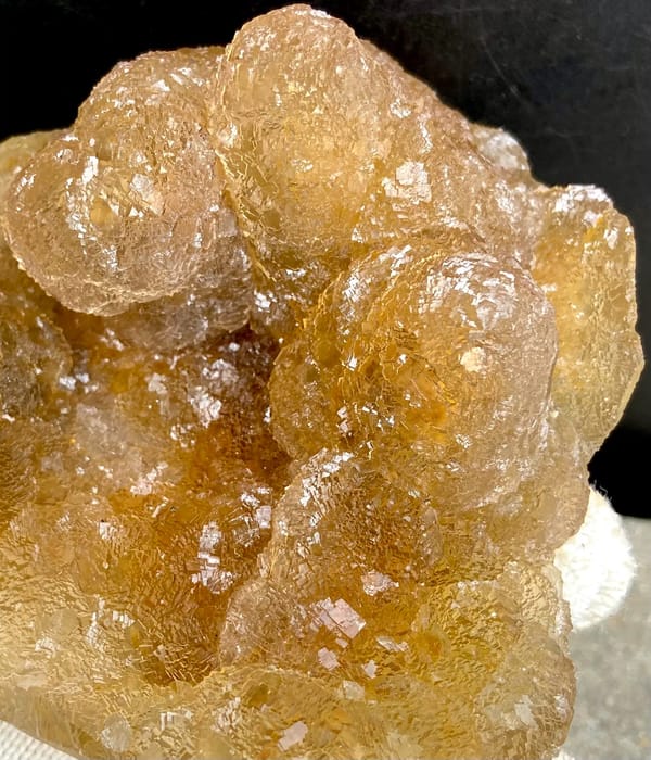 Amber pineapple fluorite of stacked translucent columns from Henan, China, close-up of terminations