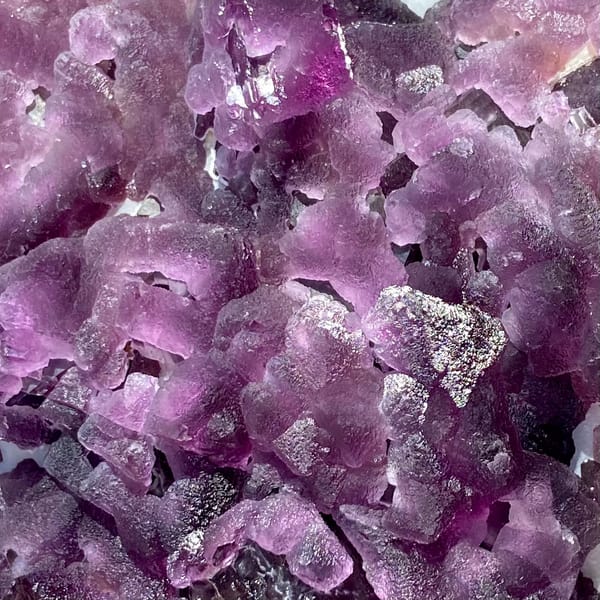 Large plate of purple recrystallised fluorite octahedra from Zhejiang, China, side view
