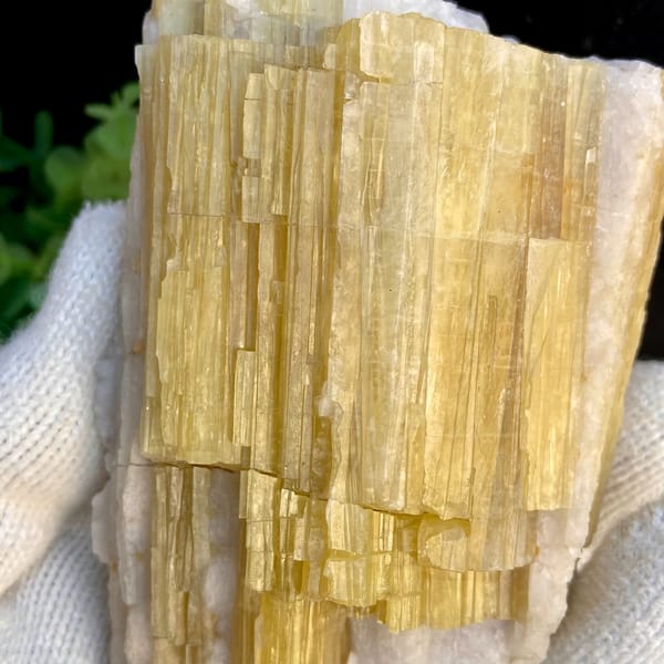 Bundle of golden-yellow prismatic topaz columns from Germany, close-up of terminations