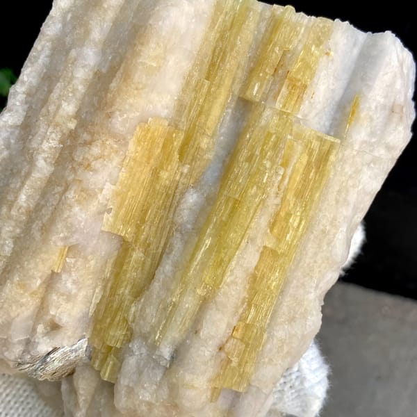 Bundle of golden-yellow prismatic topaz columns from Germany, overall view