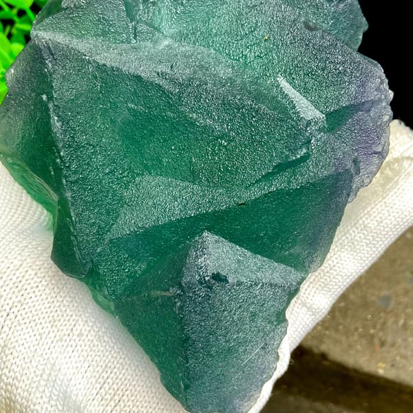 Cluster of green fluorite octahedra with purple edges from Zhejiang, China, side view