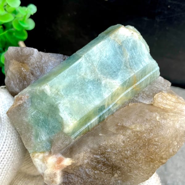 Large blue-green aquamarine prism in smoky quartz from Yunxiao, Fujian, China, close-up of the crystal faces