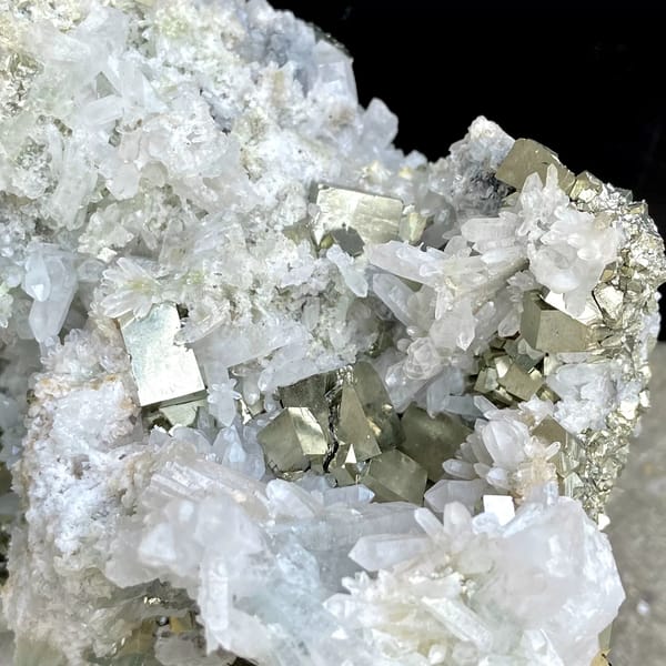 White quartz cluster studded with pyrite cubes from Shangbao, Hunan, China, close-up of the crystal faces
