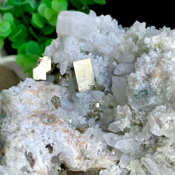 White quartz cluster studded with pyrite cubes from Shangbao, Hunan, China, side view