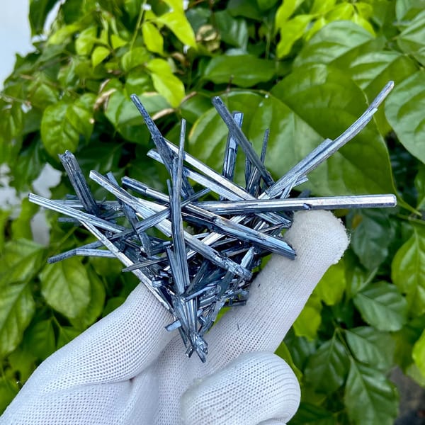 Floater spray of steel-grey stibnite needles from Jiangxi, China, second angle