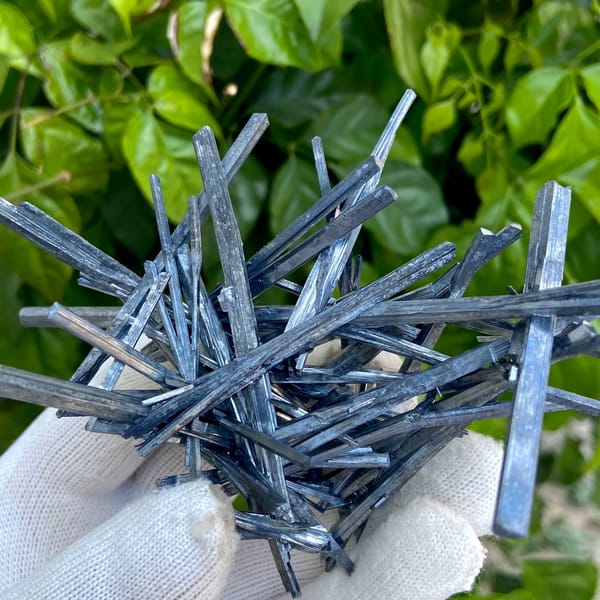 Floater spray of steel-grey stibnite needles from Jiangxi, China, side view
