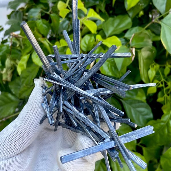 Floater spray of steel-grey stibnite needles from Jiangxi, China, overall view