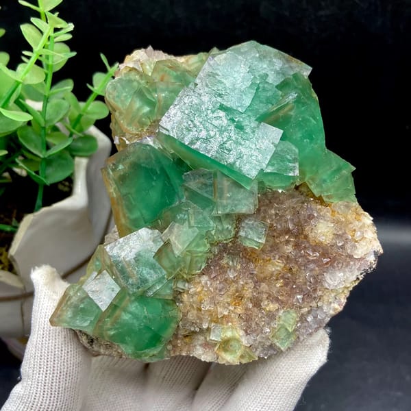 Dome of transparent sea-green fluorite cubes from Hebei, China, close-up of the crystal faces