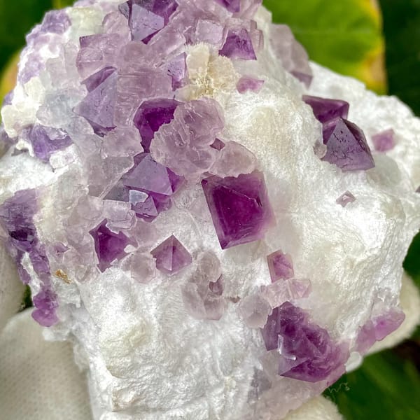 Purple-red fluorite octahedra on white recrystallised block from Zhejiang, China, overall view