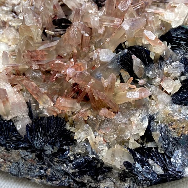 Plate of black specular hematite with pink-skinned quartz from Guangdong, China, overall view