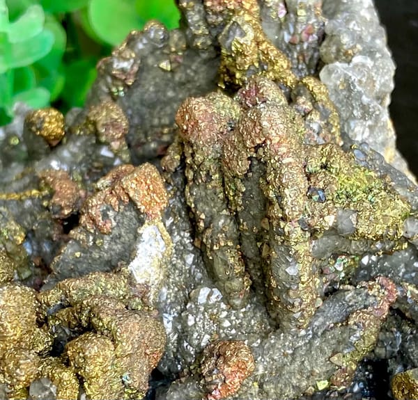 Plate of petal calcite coated in iridescent pyrite from Hubei, China, close-up of terminations