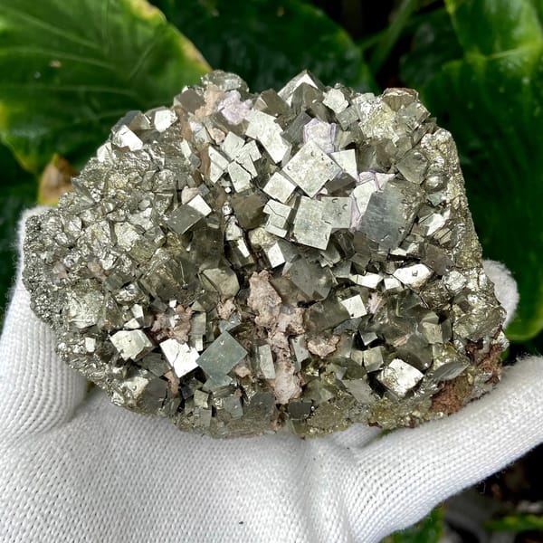 Dome of sharp brassy pyrite cubes from Shangbao, Hunan, China, close-up of the crystal faces