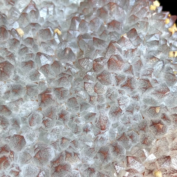 Red-skinned quartz fan with dolomite on carved stand from Jiangxi, China, detail of the matrix contact