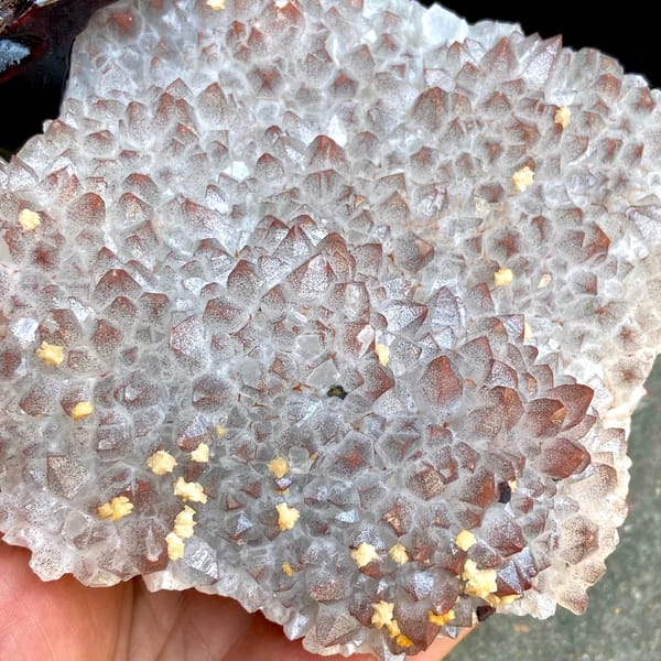 Red-skinned quartz fan with dolomite on carved stand from Jiangxi, China, overall view