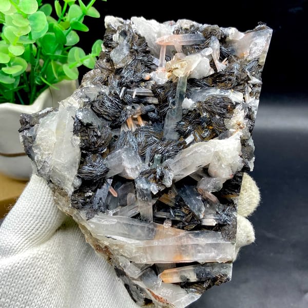 Plate of black specular hematite with quartz prisms from Guangdong, China, close-up of terminations
