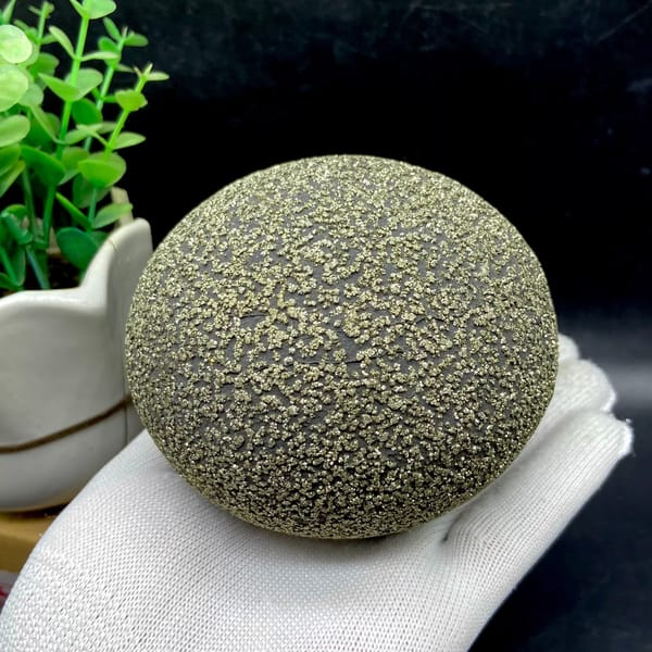 Large iron concretion sphere dusted with pyrite from Yunnan, China, detail of the matrix contact