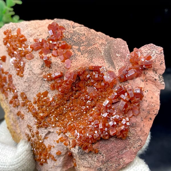 Red vanadinite crystals over salmon plate from Morocco, top view