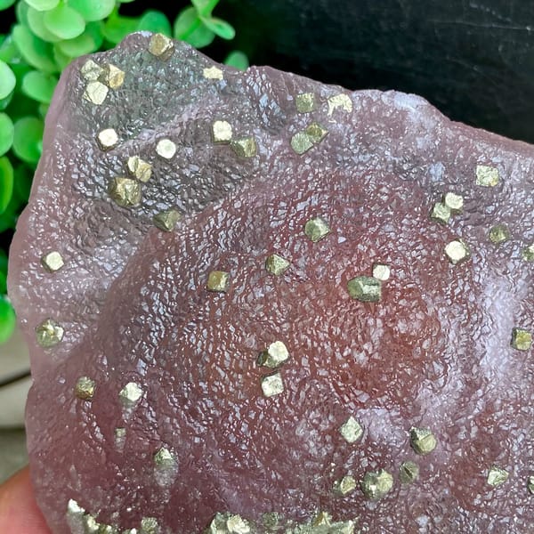 Pink-purple botryoidal fluorite dome speckled with pyrite from Jiangxi, China, reverse side