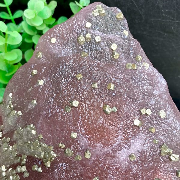 Pink-purple botryoidal fluorite dome speckled with pyrite from Jiangxi, China, overall view