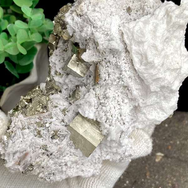 Pyrite cluster set in white matrix from Shangbao, Hunan, China, side view
