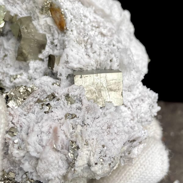 Pyrite cluster set in white matrix from Shangbao, Hunan, China, overall view