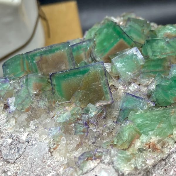 Plate of glassy green fluorite cubes with purple edges from Hebei, China, second angle