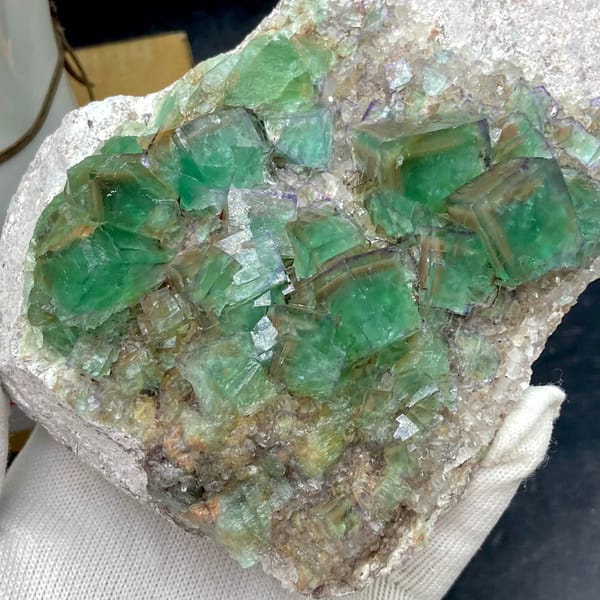 Plate of glassy green fluorite cubes with purple edges from Hebei, China, top view