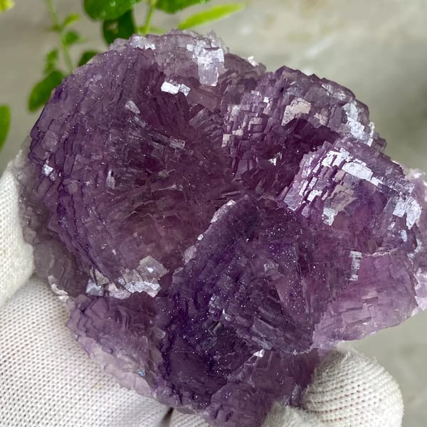 Dome of stepped purple fluorite from Henan, China, detail of the matrix contact