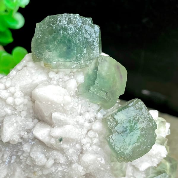 Sea-green fluorite cubes crowning white quartz cluster from Inner Mongolia, China, top view