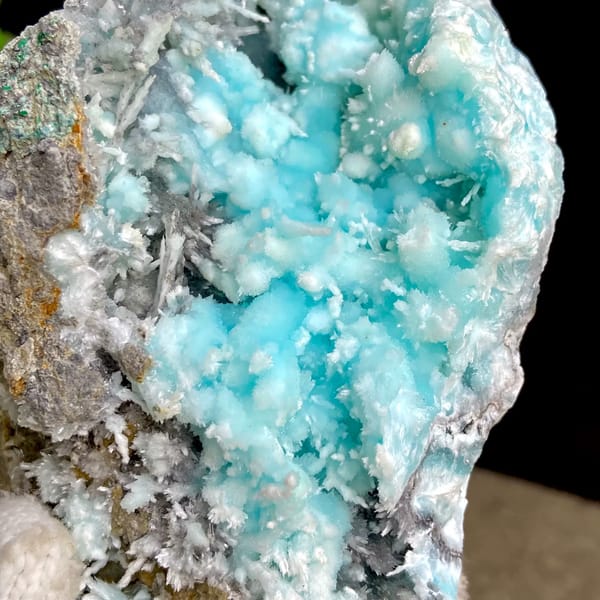 Sky-blue botryoidal aragonite over white needles from Yunnan, China, side view
