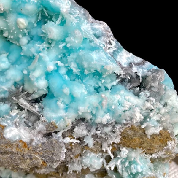 Sky-blue botryoidal aragonite over white needles from Yunnan, China, close-up of terminations