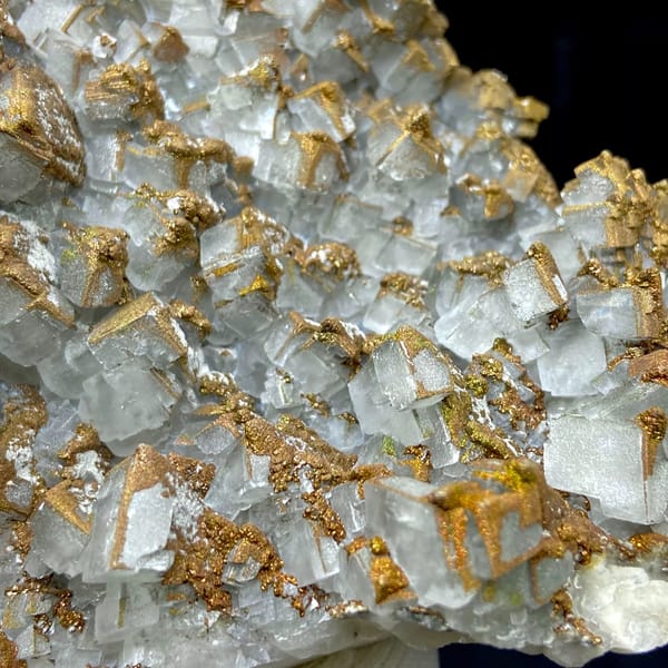 Plate of pale pyramid calcite coated in rusty iridescent pyrite from Hunan, China, second angle