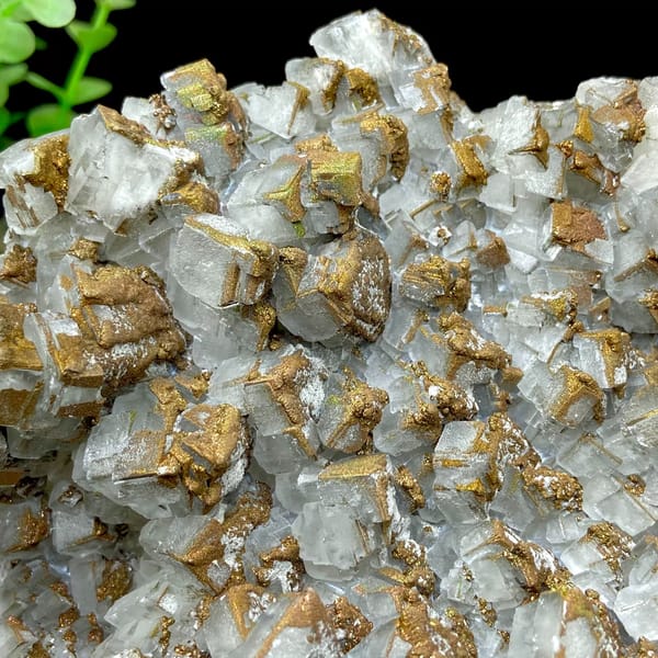 Plate of pale pyramid calcite coated in rusty iridescent pyrite from Hunan, China, overall view