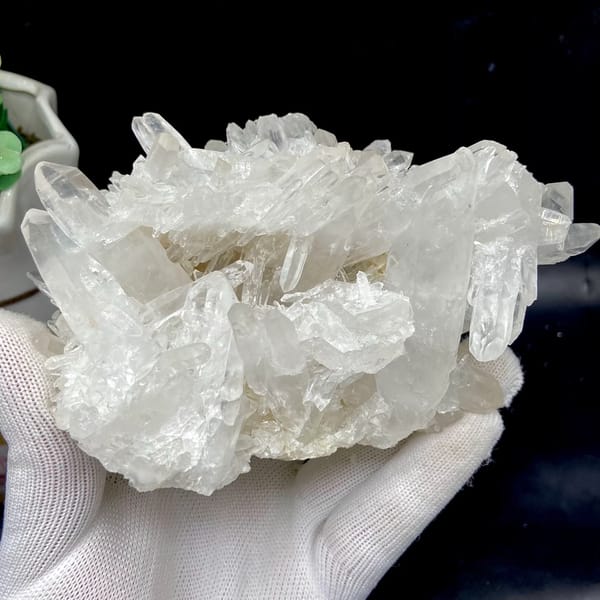 Cluster of clear double-terminated quartz needles from Jinkouhe, Sichuan, China, close-up of the crystal faces