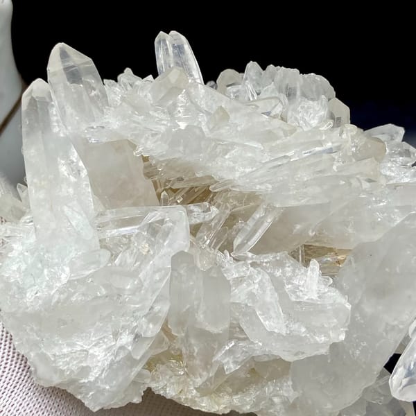 Cluster of clear double-terminated quartz needles from Jinkouhe, Sichuan, China, reverse side
