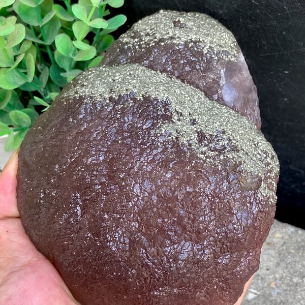 Plum-purple botryoidal fluorite ball dusted with pyrite from Jiangxi, China, overall view