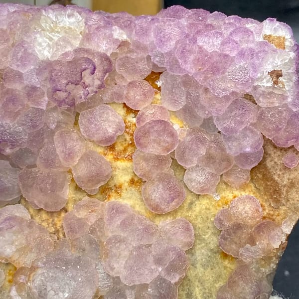 Plate of lavender botryoidal fluorite from Guizhou, China, close-up of the crystal faces