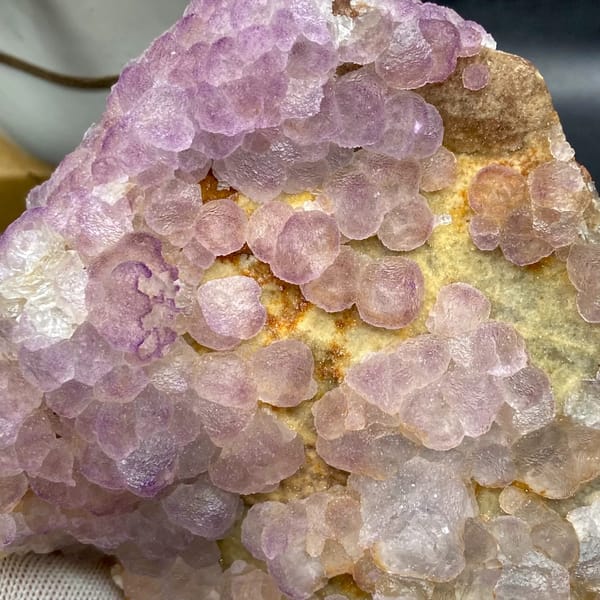 Plate of lavender botryoidal fluorite from Guizhou, China, reverse side