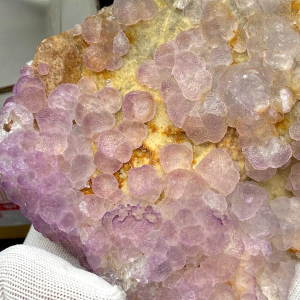 Plate of lavender botryoidal fluorite from Guizhou, China, side view