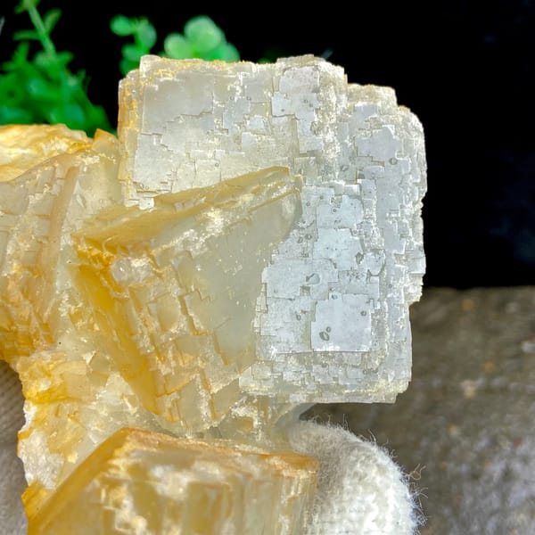 Pale stepped fluorite cube with honey-yellow edges from Hunan, China, side view