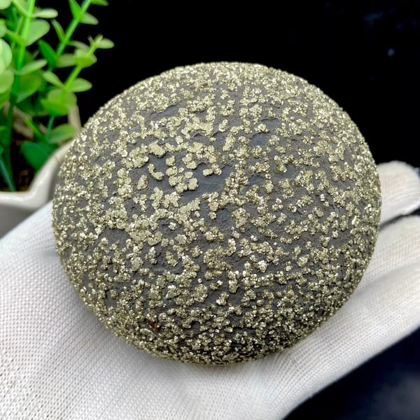 Iron concretion sphere with dense pyrite crust from Yunnan, China, close-up of the crystal faces