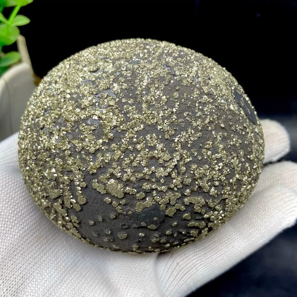 Iron concretion sphere with dense pyrite crust from Yunnan, China, close-up of terminations